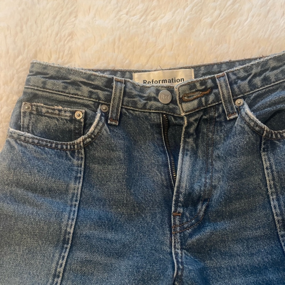 Reformation straight leg jeans with hem down the middle